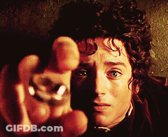 A Close Up Of A Man 'S Face With A Ring In His Finger GIF