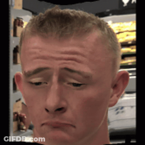A Close Up Of A Man 'S Face With A Sad Look On It GIF