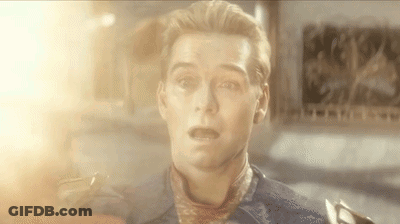A Close Up Of A Man 'S Face With A Scarf Around His Neck And A Surprised Look On His Face . GIF