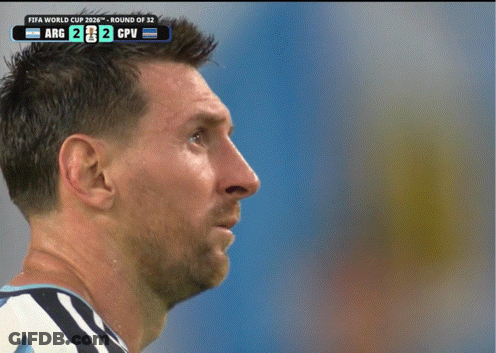 A Close Up Of A Man 'S Face With A Scoreboard Behind Him That Says Fifa World Cup GIF