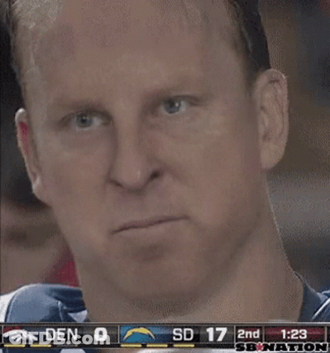 A Close Up Of A Man 'S Face With A Scoreboard Behind Him That Says Sd 17 GIF