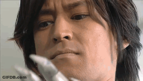 A Close Up Of A Man 'S Face With A Serious Expression GIF