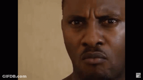 A Close Up Of A Man 'S Face With A Serious Expression . GIF