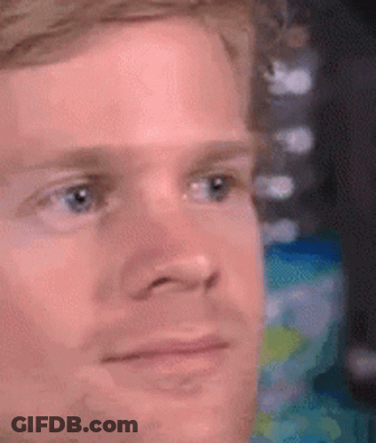 A Close Up Of A Man 'S Face With A Serious Expression . GIF