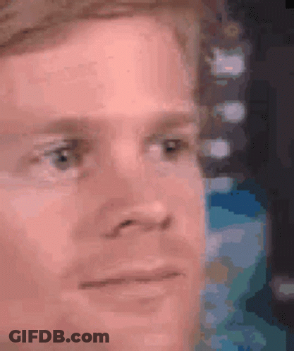 A Close Up Of A Man 'S Face With A Serious Expression . GIF