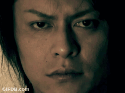 A Close Up Of A Man 'S Face With A Serious Expression GIF
