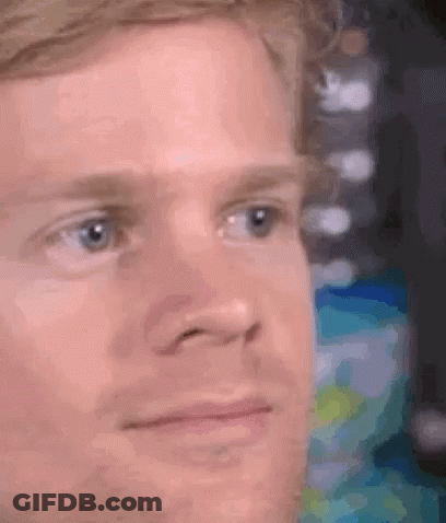 A Close Up Of A Man 'S Face With A Serious Expression On His Face . GIF