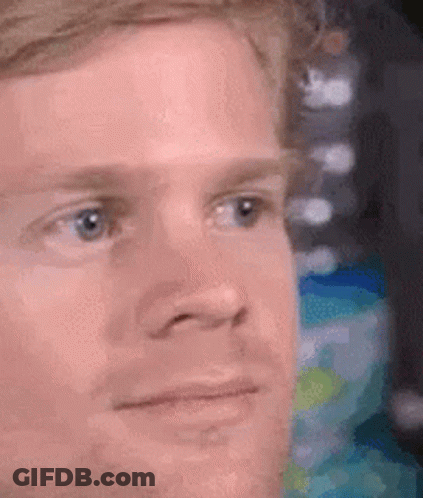 A Close Up Of A Man 'S Face With A Serious Expression On His Face . GIF