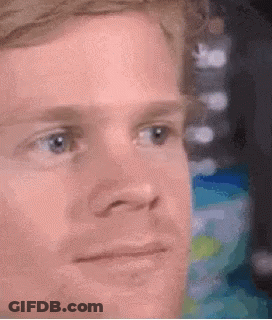 A Close Up Of A Man 'S Face With A Serious Expression On His Face . GIF