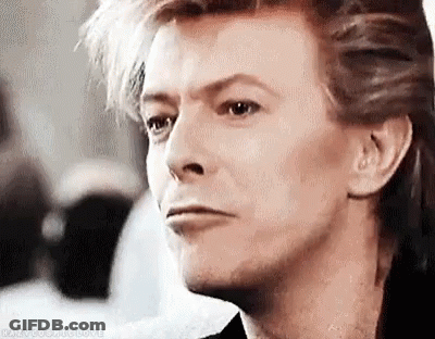 A Close Up Of A Man 'S Face With A Serious Expression On His Face . GIF