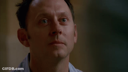 A Close Up Of A Man 'S Face With A Serious Expression GIF
