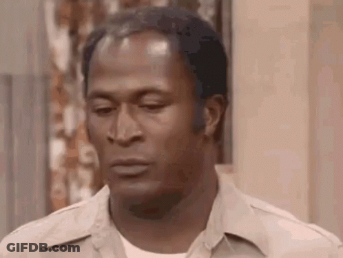 A Close Up Of A Man 'S Face With A Serious Expression . GIF
