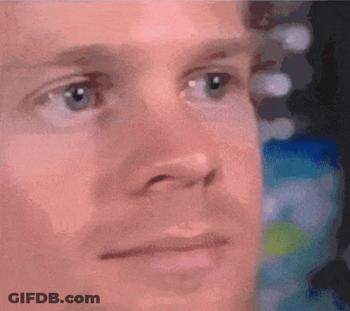 A Close Up Of A Man 'S Face With A Serious Look On His Face GIF