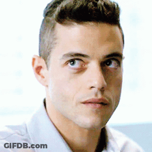 A Close Up Of A Man 'S Face With A Serious Look On His Face . GIF