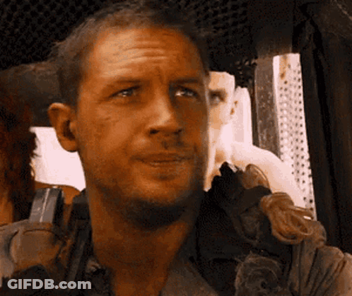A Close Up Of A Man 'S Face With A Serious Look On His Face GIF