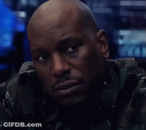 A Close Up Of A Man 'S Face With A Serious Look On His Face GIF