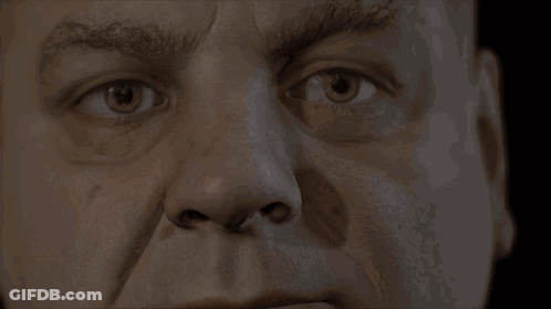 A Close Up Of A Man 'S Face With A Serious Look On His Face GIF