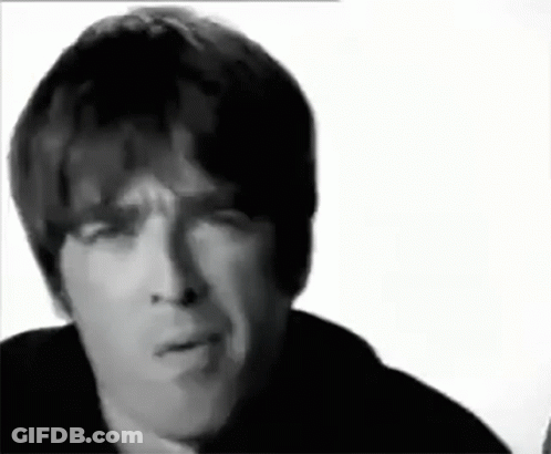 A Close Up Of A Man 'S Face With A Serious Look On His Face In A Black And White Photo . GIF