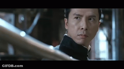 A Close Up Of A Man 'S Face With A Serious Look On His Face GIF