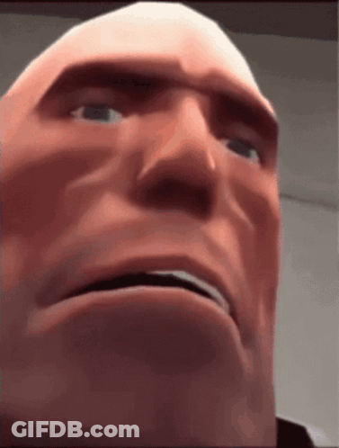 A Close Up Of A Man 'S Face With A Serious Look On His Face . GIF