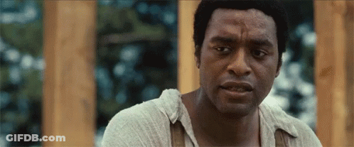 A Close Up Of A Man 'S Face With A Serious Look On His Face . GIF