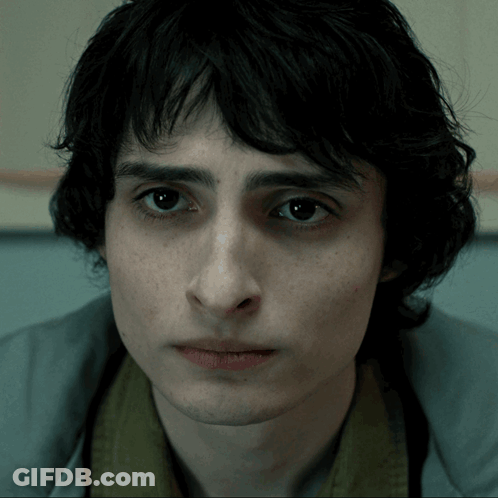 A Close Up Of A Man 'S Face With A Serious Look On His Face GIF