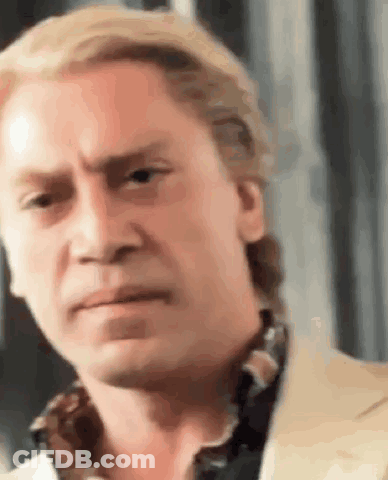 A Close Up Of A Man 'S Face With A Serious Look On It . GIF