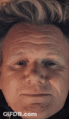 A Close Up Of A Man 'S Face With A Serious Look GIF