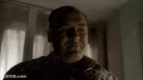 A Close Up Of A Man 'S Face With A Shadow On His Face . GIF