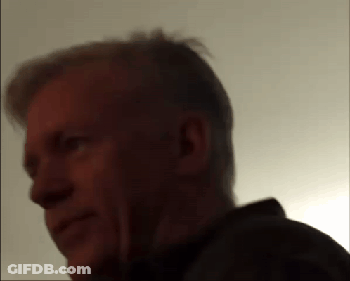 A Close Up Of A Man 'S Face With A Shadow On His Face GIF