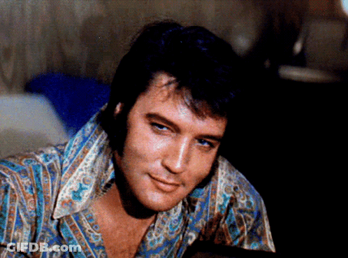 A Close Up Of A Man 'S Face With A Shirt That Says ' Elvis Presley ' On It GIF