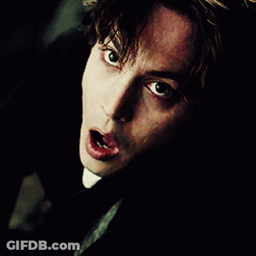 A Close Up Of A Man 'S Face With A Shocked Look On His Face GIF