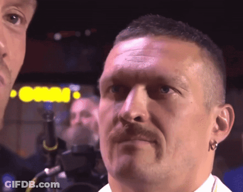 A Close Up Of A Man 'S Face With A Sign Behind Him That Says Casino GIF
