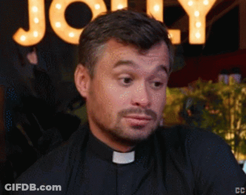 A Close Up Of A Man 'S Face With A Sign Behind Him That Says Jolly GIF