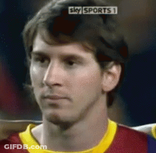 A Close Up Of A Man 'S Face With A Sky Sports 1 Advertisement Behind Him GIF