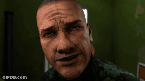 A Close Up Of A Man 'S Face With A Slight Smirk On It GIF