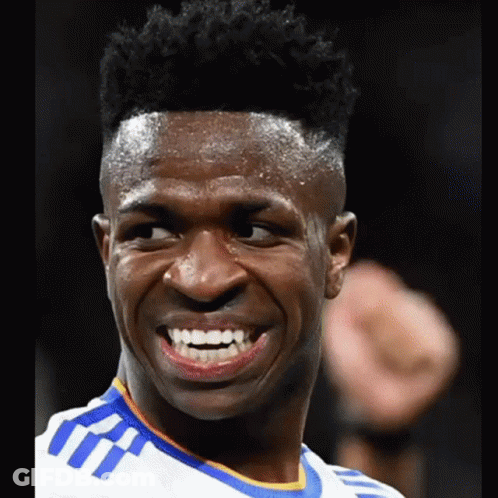 A Close Up Of A Man 'S Face With A Smile On His Face GIF