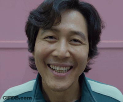 A Close Up Of A Man 'S Face With A Smile On His Face GIF