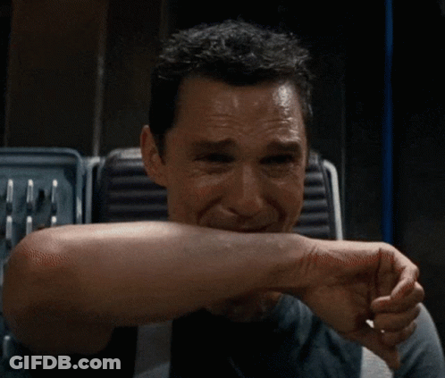 A Close Up Of A Man 'S Face With A Smile On His Face GIF