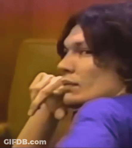 A Close Up Of A Man 'S Face With A Smile On His Face . GIF