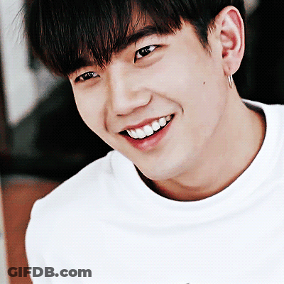 A Close Up Of A Man 'S Face With A Smile On His Face GIF