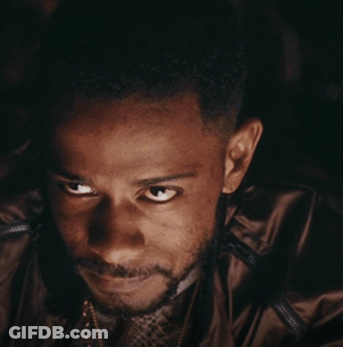 A Close Up Of A Man 'S Face With A Smile On His Face GIF