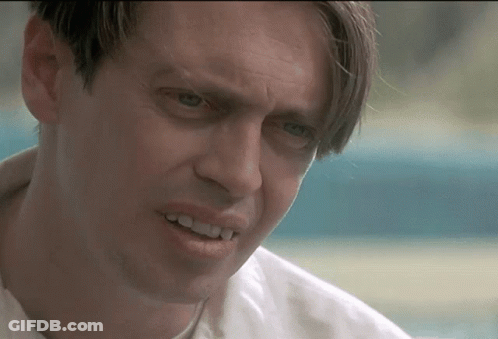 A Close Up Of A Man 'S Face With A Smile On His Face GIF