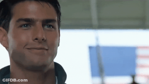A Close Up Of A Man 'S Face With A Smile On His Face . GIF