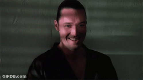 A Close Up Of A Man 'S Face With A Smile On It GIF