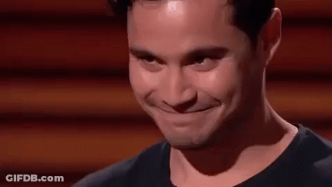 A Close Up Of A Man 'S Face With A Smile On It . GIF