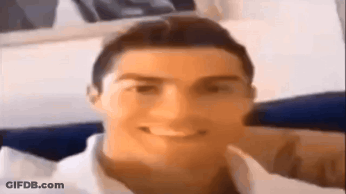 A Close Up Of A Man 'S Face With A Smile On It . GIF