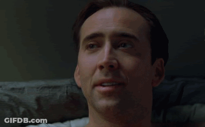 A Close Up Of A Man 'S Face With A Smile On It GIF
