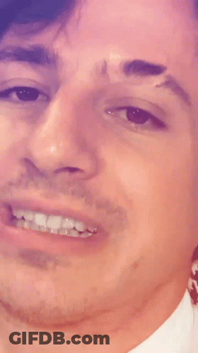 A Close Up Of A Man 'S Face With A Smile GIF