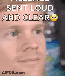 A Close Up Of A Man 'S Face With A Smiley Face And The Words `` Sent Loud And Clear '' . GIF